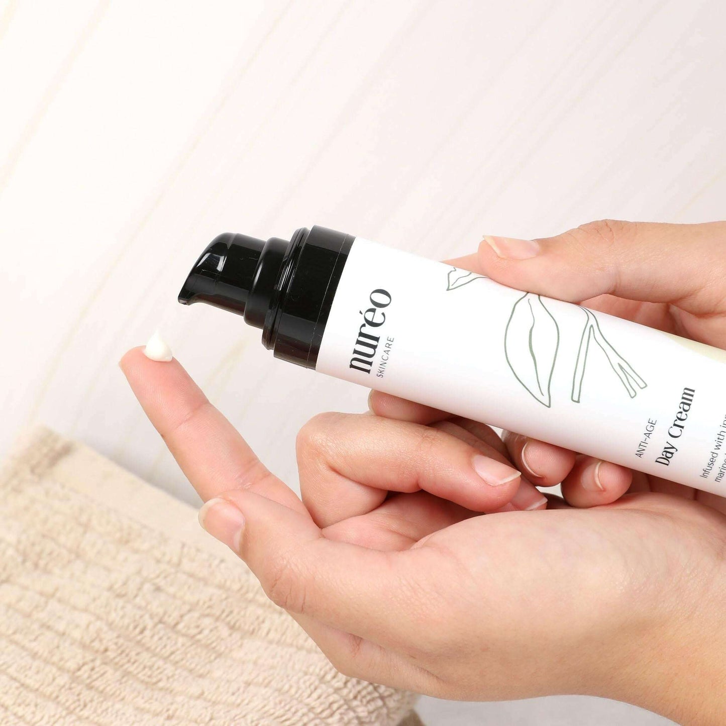 GlowGuard Anti-Aging Cream in hand application scene
