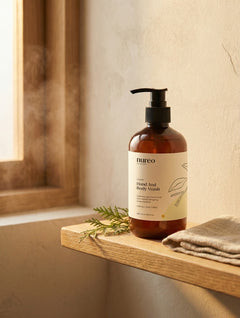 nuréo Cedar Hand & Body Wash on a wooden bath shelf